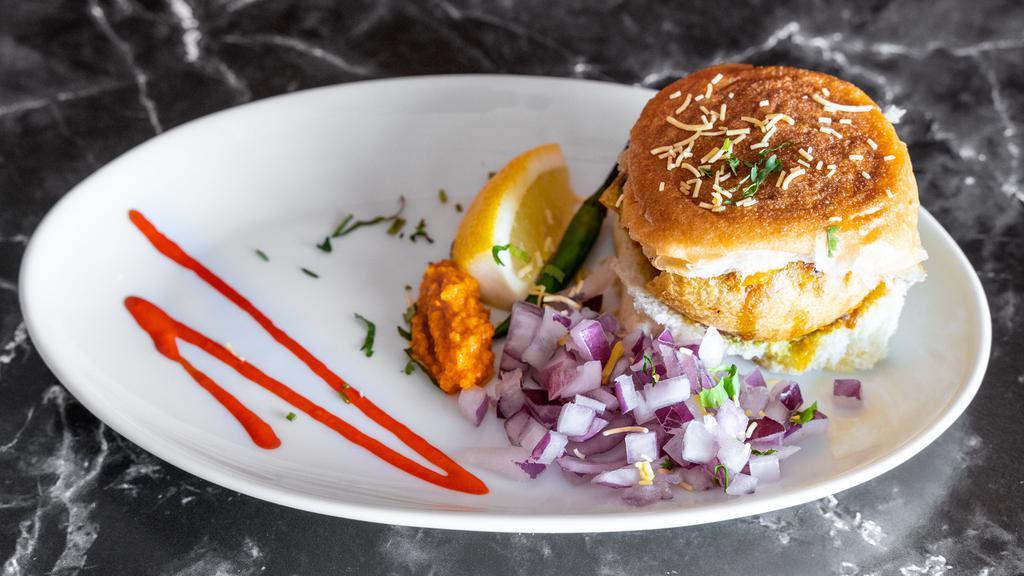 Vada Pav - 1 pc · Irresistibly Flavorful Potato balls, Sandwiched Between Two Slices Of Pav Served With Chutneys.