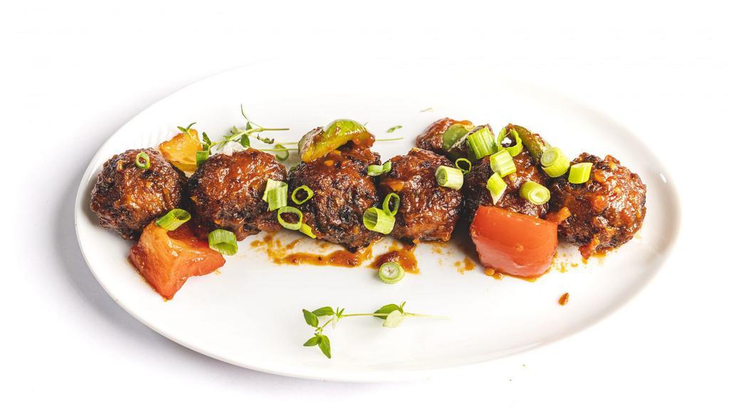 Vegetarian Manchurian Dry / Gravy · Vegan. Palatable and Satiating dish of mixed vegetable dumplings in a glossy, rich-brown chef's special sauce with bold notes of tangy, sweet, spicy and salty; impossible to resist.
