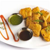 Paneer Pakora · Gluten-Free. Indian Cottage cheese Fritters Deep-Fried with Chickpea Flour Batter; Sprinkled...