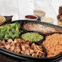 Family Taco Kit  · Choice of all-natural grilled chicken, USDA Choice Steak or grilled shrimp, choice of pinto ...