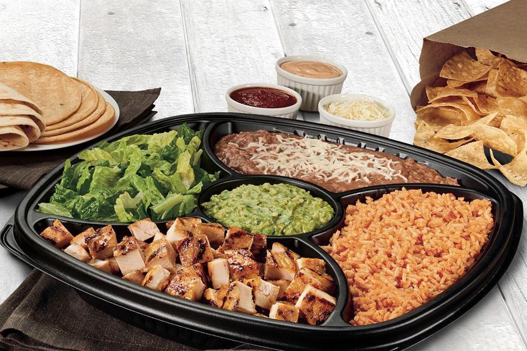 Family Taco Kit  · Choice of all-natural grilled chicken, USDA Choice Steak or grilled shrimp, choice of pinto beans or black beans, choice of citrus rice or Mexican rice, guacamole, romaine, three cheese blend, chipotle sauce, mild salsa, a mix of 8 corn and flour tortillas and tortilla chips.  Serves 4-5..