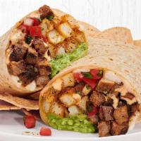 California Burrito with Grilled, USDA-Choice Steak · Grilled, USDA-Choice Steak with fresh guacamole, seasoned French fries, creamy chipotle sauc...