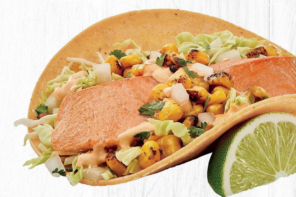 Atlantic Salmon Taco (A La Carte) · Sustainably-sourced Atlantic Salmon served on a corn tortilla with fire-roasted corn, creamy chipotle sauce, cilantro/onion mix and cabbage. .