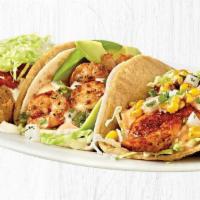 The Coastal Trio® · A flight of three of our most popular tacos:. • The Original Fish Taco®*. • Salsa Verde Shri...