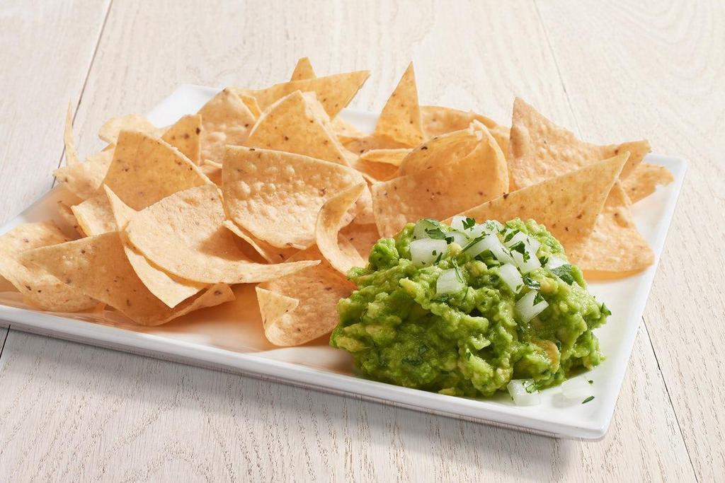 Fresh Guacamole & Chips · Made fresh daily with Hass avocados, natural sea salt, garlic and lime juice. Served with tortilla chips.