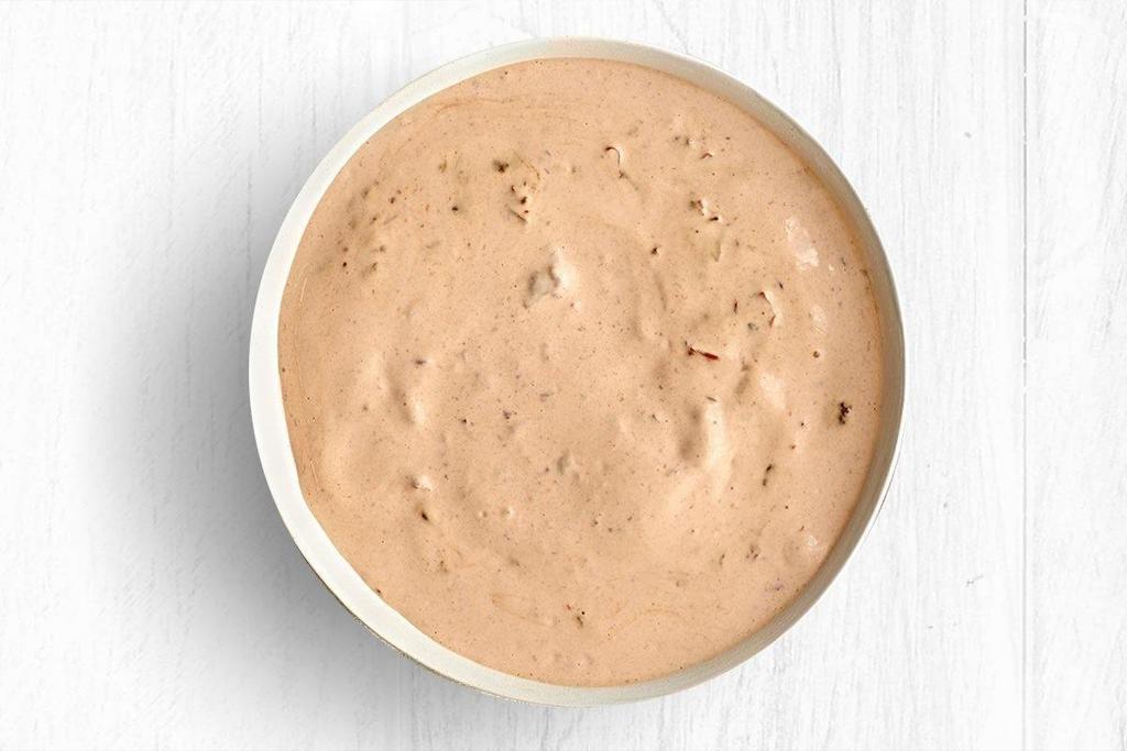 Chipotle White Sauce · A creamy, spicy sauce with smoky chipotle peppers.