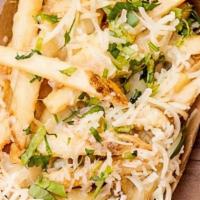 GARLIC FRIES · Signature fries, with  fresh garlic and 6-month aged cheddar.