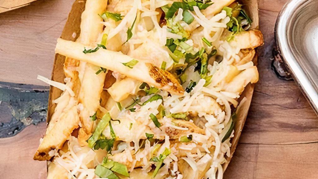 GARLIC FRIES · Signature fries, with  fresh garlic and 6-month aged cheddar.