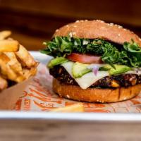 VEGGIE BURGER · Organic veggie patty served on a fresh baked bun with lettuce, tomato, red onion, and house-...