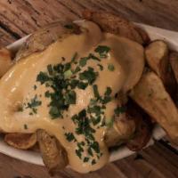 Papas Bravas · Served with chipotle aioli. Add cheese, aioli, avocado or bacon for an additional charge.