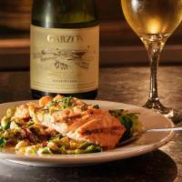Grilled Salmon · Caramelized brussels sprouts, bacon, saffron beurre blanc.