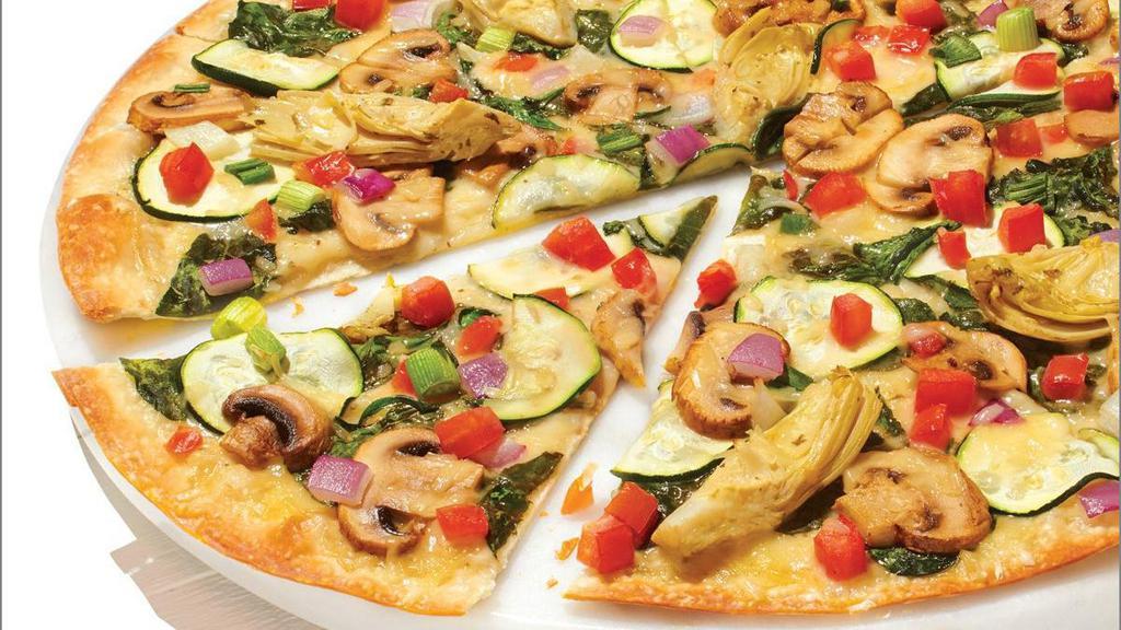 Dairy Free Cheese Gourmet Vegetarian - Baking Required · Our Artisan Thin Crust, topped with Creamy Garlic Sauce, Dairy Free Mozzarella, Fresh Spinach, Sliced Zucchini, Sliced Mushrooms, Marinated Artichoke Hearts, Roma Tomatoes, Mixed Onions. *Sauce contains dairy. Substitute Traditional Red Sauce or Olive Oil & Garlic for a dairy-free pizza
