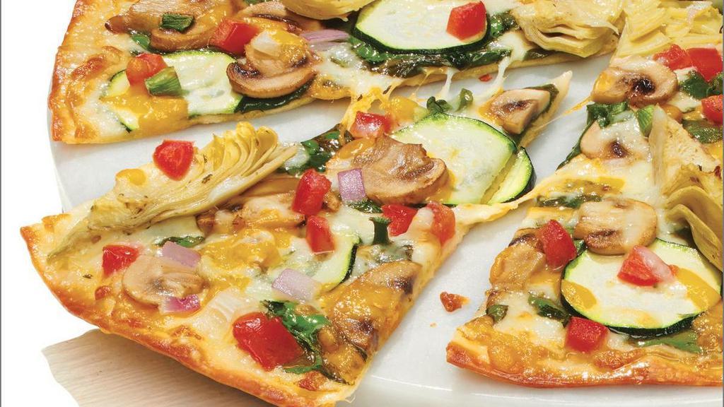 Gourmet Vegetarian - Baking Required · Our Artisan Thin Crust, topped with Creamy Garlic Sauce,  Whole-Milk Mozzarella, Fresh Spinach, Sliced Zucchini, Sliced Mushrooms, Marinated Artichoke Hearts, Roma Tomatoes, Mixed Onions, Cheddar, and Herb & Cheese Blend