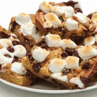 S'Mores Bars - Baking Required · Scratch-made Cookie Dough with Chocolate Chips spread into a tray and topped with Marshmallo...