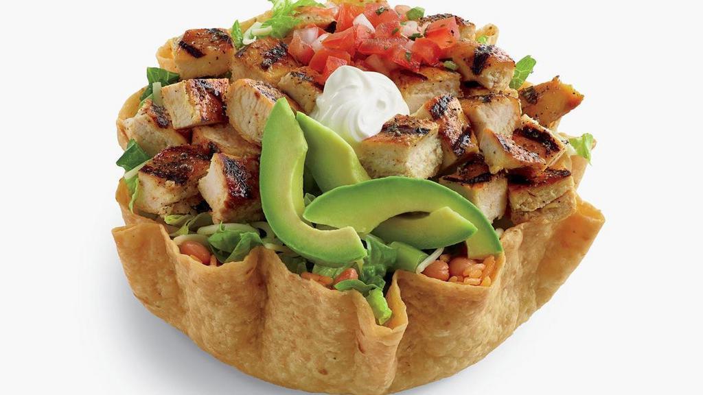 Double Chicken Tostada Salad  · Tostada shell filled with pinto beans, rice, shredded cheese, fresh pico de gallo salsa, ripe hand-sliced avocado and cool sour cream, all topped with a double portion of fire-grilled chopped chicken. Served with creamy cilantro dressing. . Includes chips and salsa.