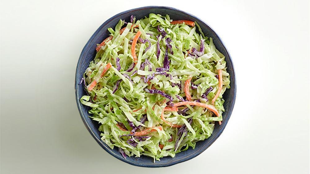 Coleslaw  · Shredded green and red cabbage and shredded carrots combined with a creamy sweet and sour dressing.