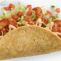 Baja Shrimp Taco · Cooked to perfection in a chipotle and garlic marinade. The Baja Shrimp Taco is topped with ...