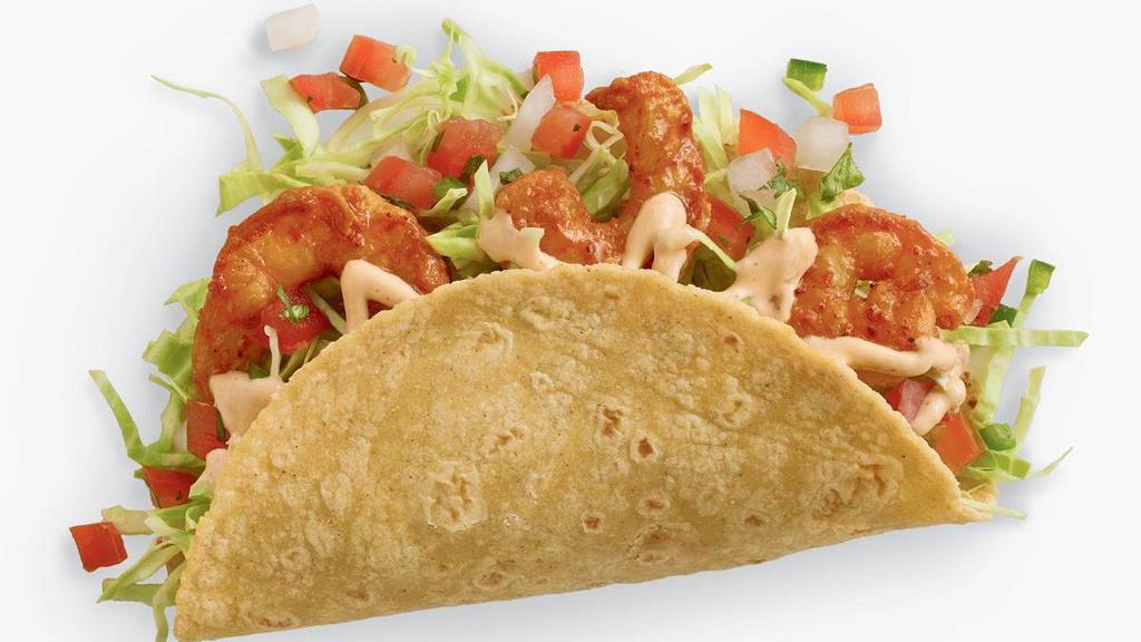 Baja Shrimp Taco · Cooked to perfection in a chipotle and garlic marinade. The Baja Shrimp Taco is topped with fresh shredded cabbage, house-made pico de gallo and baja chipotle sauce – all wrapped in a corn tortilla.