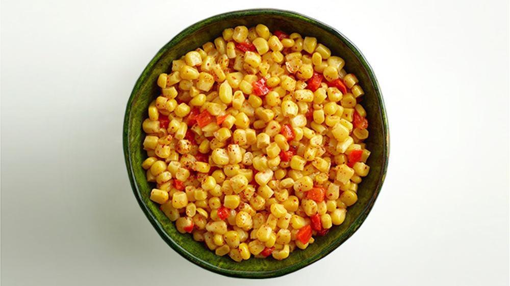 Corn · Cut corn mixed with diced red peppers, lightly coated in a delicate buttery sauce.