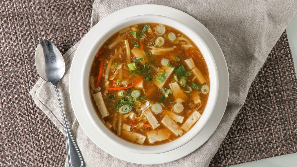 Hot & Sour Soup · Shredded pork, bamboo shoots and bean curd in thickened chicken broth.