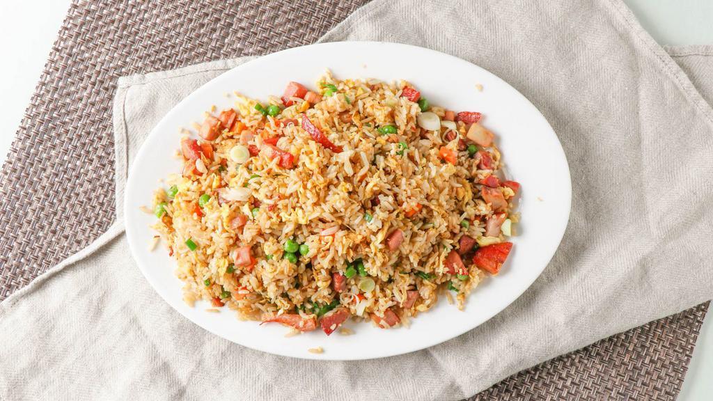 Barbecued Pork Fried Rice · Rice stir-fried with barbecued pork, eggs, peas, carrots, and green onions.