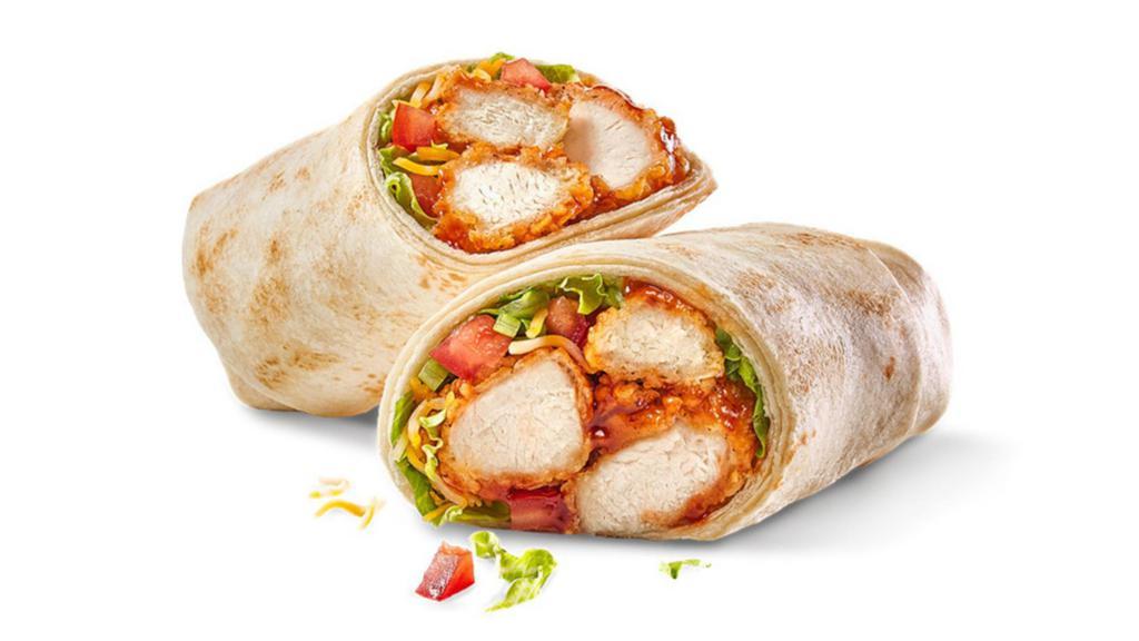 Classic Chicken Wrap · HAND-BREADED OR PULLED CHICKEN / CHOICE OF SAUCE OR DRY SEASONING / CHEDDAR-JACK CHEESE / SHREDDED ICEBERG LETTUCE / TOMATOES / FLOUR TORTILLA / HOUSE-MADE TORTILLA CHIPS & SALSA