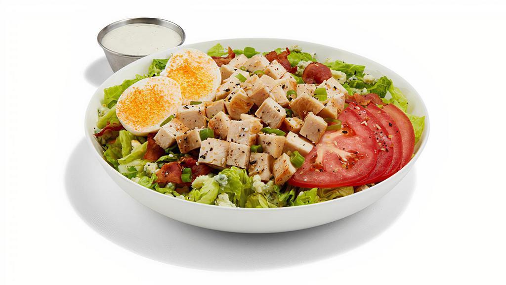 Chopped Cobb Salad · PULLED CHICKEN / ROMAINE LETTUCE / TOMATOES / BACON / HARD-BOILED EGG / RANCH DRESSING / BLEU CHEESE CRUMBLES / GREEN ONIONS / BUFFALO SEASONING / EVERYTHING SEASONING