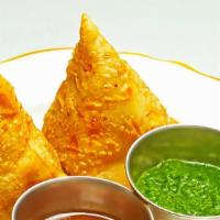Samosa · Homemade pastry puff stuffed with potatoes, peas served with chutney.
