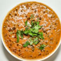 Dal Makhani · Black beans, chickpeas, and kidney beans boiled together in water and cooked in the base gra...