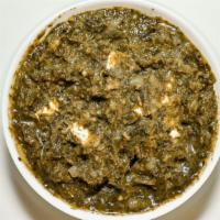 Saag Paneer · Homemade cottage cheese cubes cooked with fresh spinach leaves with a little yogurt, ginger,...