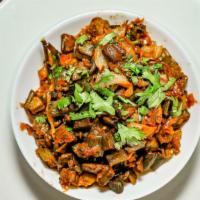 Bhindi Masala · Okra is prepared with garam masala, vine ripened tomatoes, Indian spices, and then the slice...