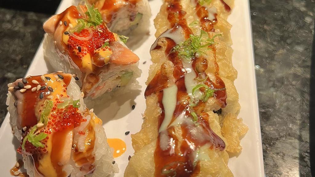 Lion King Special Roll · Imitation crab mix, avocado, salmon, and tobiko baked with house sauce.