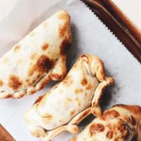 Empanadas · curry spiced vegetable, mushroom & pecorino cheese, or jerk spiced chicken 
Served with pick...