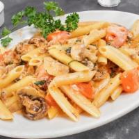 PENNE CALABRESE PASTA · Our family’s Italian sausage, fresh mushrooms, tomato cream sauce, penne pasta