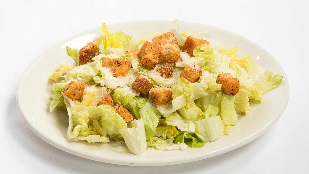 CAESAR SALAD · Traditional dressing tossed with romaine