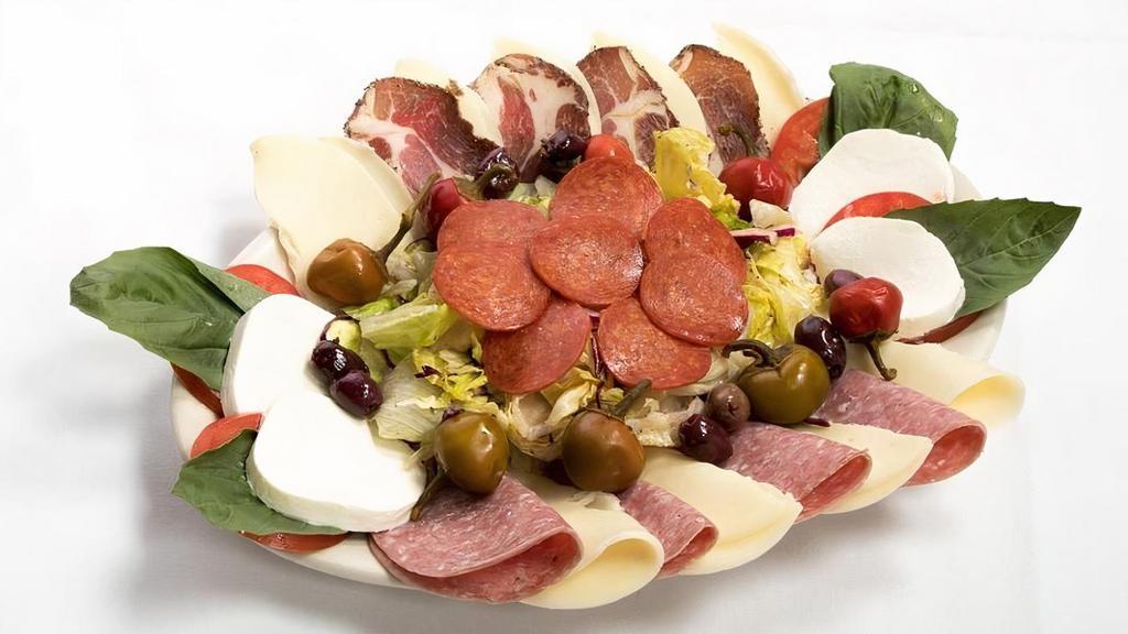 LUIGI'S INSALATA (SERVES 2/3) · capicola & dry salami, genoa salami, pepperoni, provolone, fresh mozzarella, mixed greens with Italian dressing