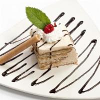 TIRAMISU · Our homemade Italian temptation, ladyfingers laced with rum and espresso, layered with sweet...