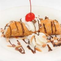 CANNOLI · Crispy fried pastry shell stuffed with sweetened ricotta cheese and chocolate chips