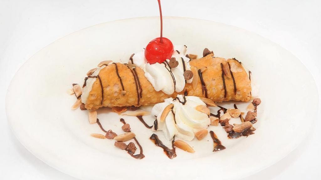 CANNOLI · Crispy fried pastry shell stuffed with sweetened ricotta cheese and chocolate chips