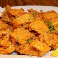 Fried Calamari · Calamari seasoned with herbs and spices, lightly floured and flash fried; served with house ...