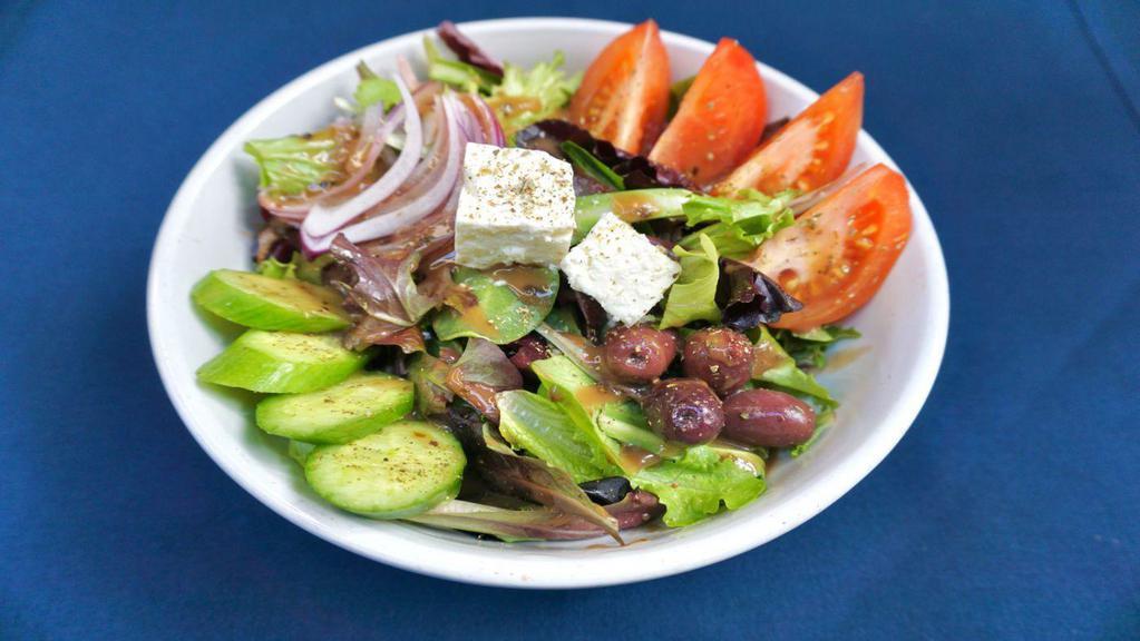 House Salad · Mixed greens, tomatoes, cucumbers, feta, red onions and Kalamata olives tossed in balsamic vinaigrette.