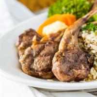 Lamb Chops · Two double cut lamb chops char-broiled over an open flame seasoned with fresh herbs and lemo...