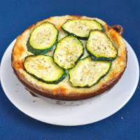 Vegetarian Moussaka · Layers of eggplant, zucchini and potatoes in a tangy marinara topped with a rich, creamy béc...