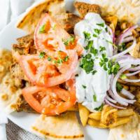Gyros Stacker · A combination of chicken and lamb/beef gyro meat, tzatziki, tomatoes, and red onions, on top...