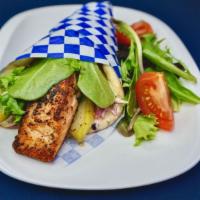 Grilled Salmon Pita · Grilled salmon served on pita with spring mix, tomatoes, red onions, pickle & our house garl...