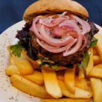 Juicy 1/3 lb Lamb-burger · Seasoned freshly ground lamb served on a toasted bun with tomatoes, picked onions, spring mi...