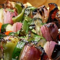 Veggie Souvlakia · Vegetable skewers with a combination of eggplant, zucchini, onions, mushrooms and bell peppe...