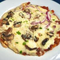 Pita Pizza · An eight inch pita topped with shredded Kasseri cheese & your choice of two toppings (onions...