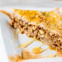 Baklava · Flaky layers of filo, almonds, and walnuts drenched with Greek honey.