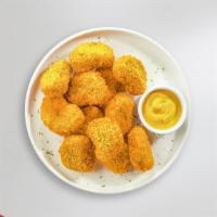 Cluck Chuck Nuggets · Bite sized nuggets of chicken breaded and fried until golden brown.